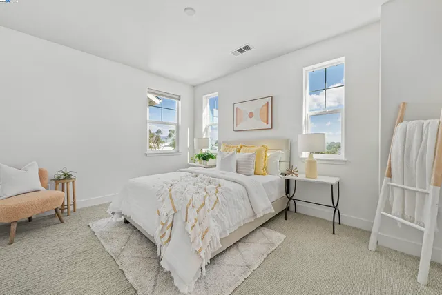 a bedroom with a bed and a cabinets