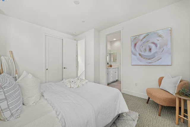 a bedroom with a bed and a chair