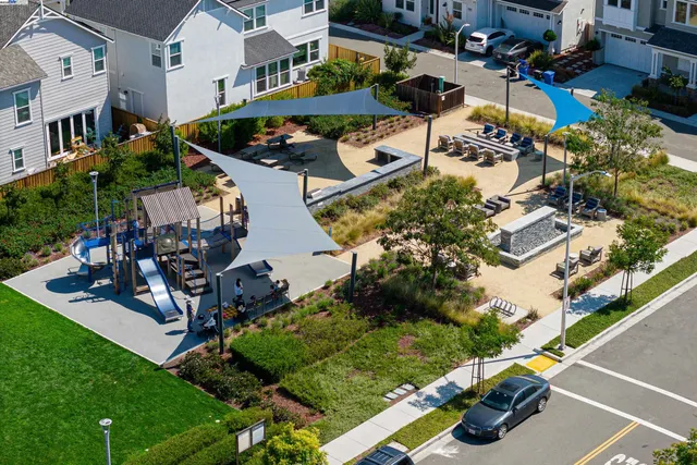 an aerial view of a house with a garden and swimming pool