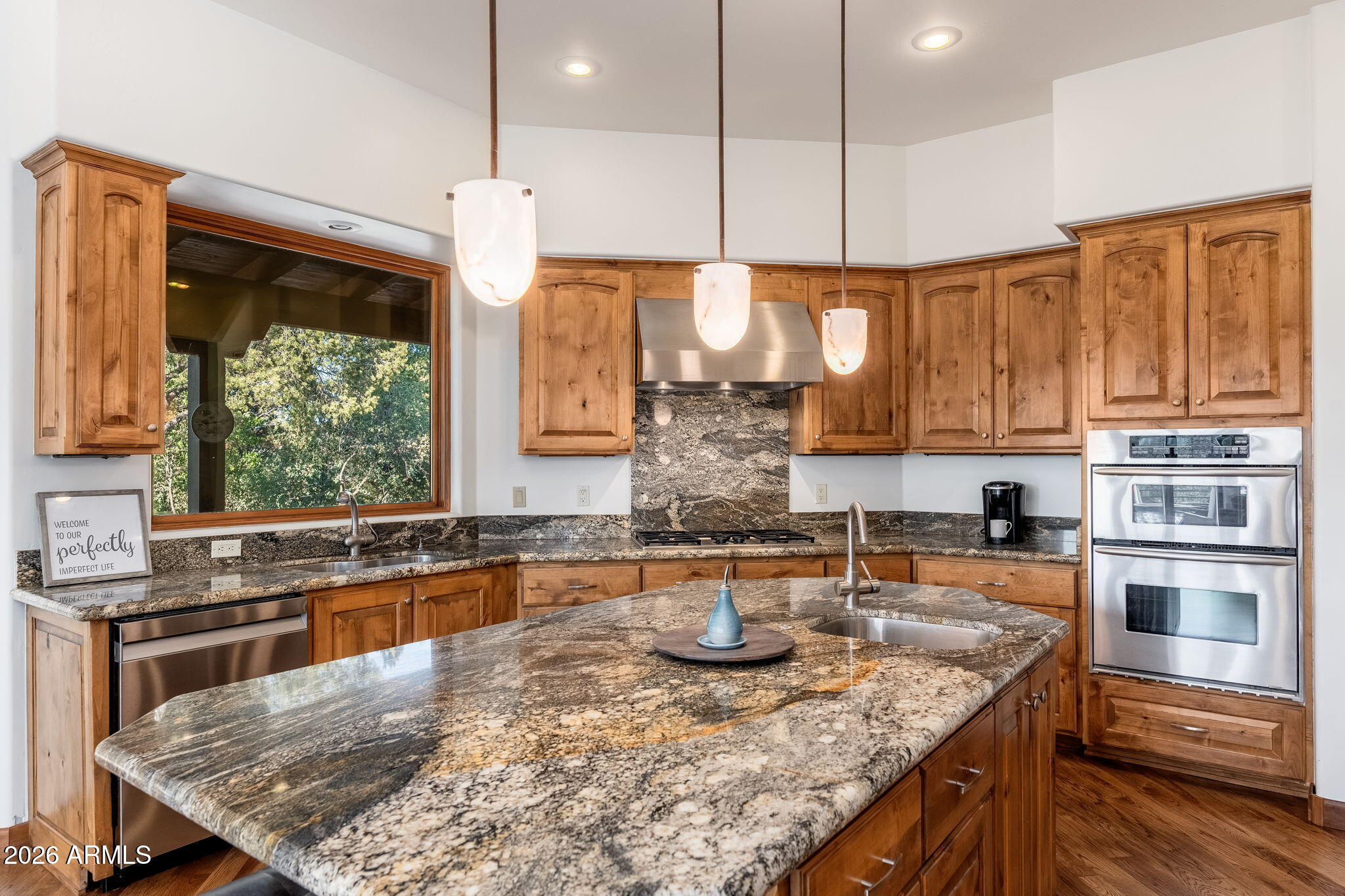 2208 East Filaree Circle Payson, AZ 85541 - Photo 11 of 60 a kitchen with stainless steel appliances granite countertop a sink a stove and a wooden cabinets