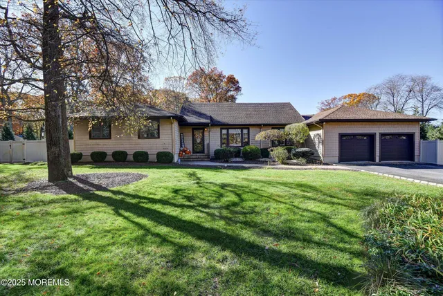 a front view of a house with a yard table and chairs