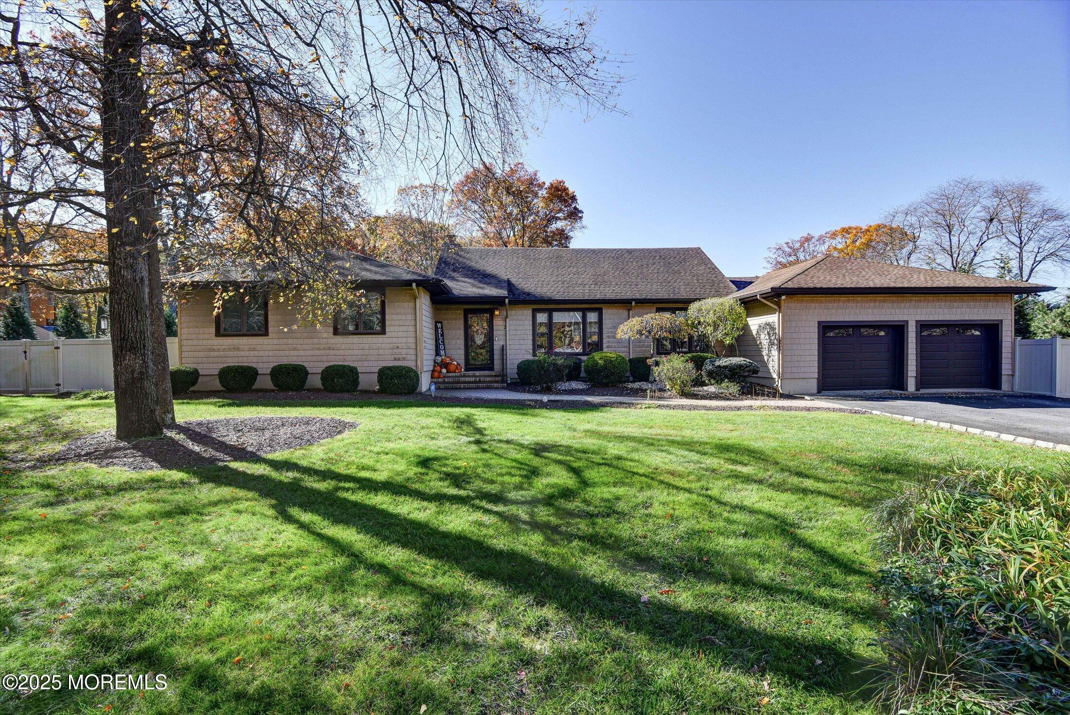 a front view of a house with a yard table and chairs
