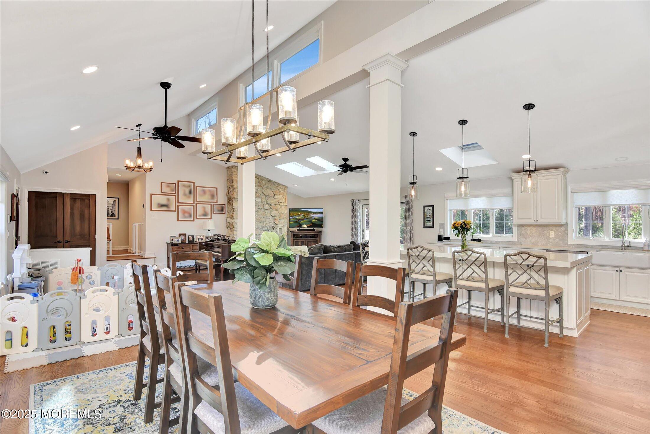 2 Lyndon Lane Howell, NJ 07731 - Photo 13 of 51 a view of a dining room and livingroom with furniture wooden floor a chandelier