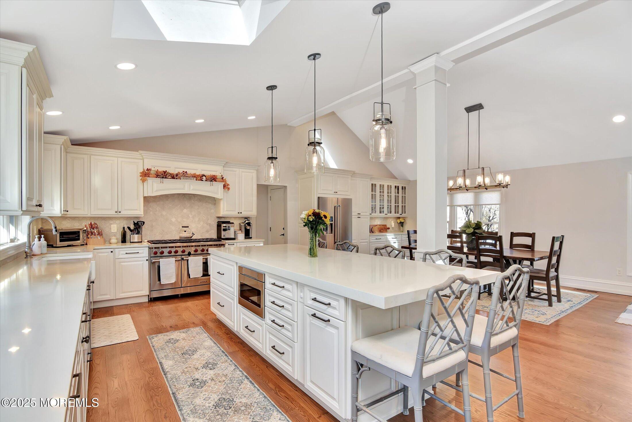 2 Lyndon Lane Howell, NJ 07731 - Photo 18 of 51 a large kitchen with kitchen island a large island in white appliances