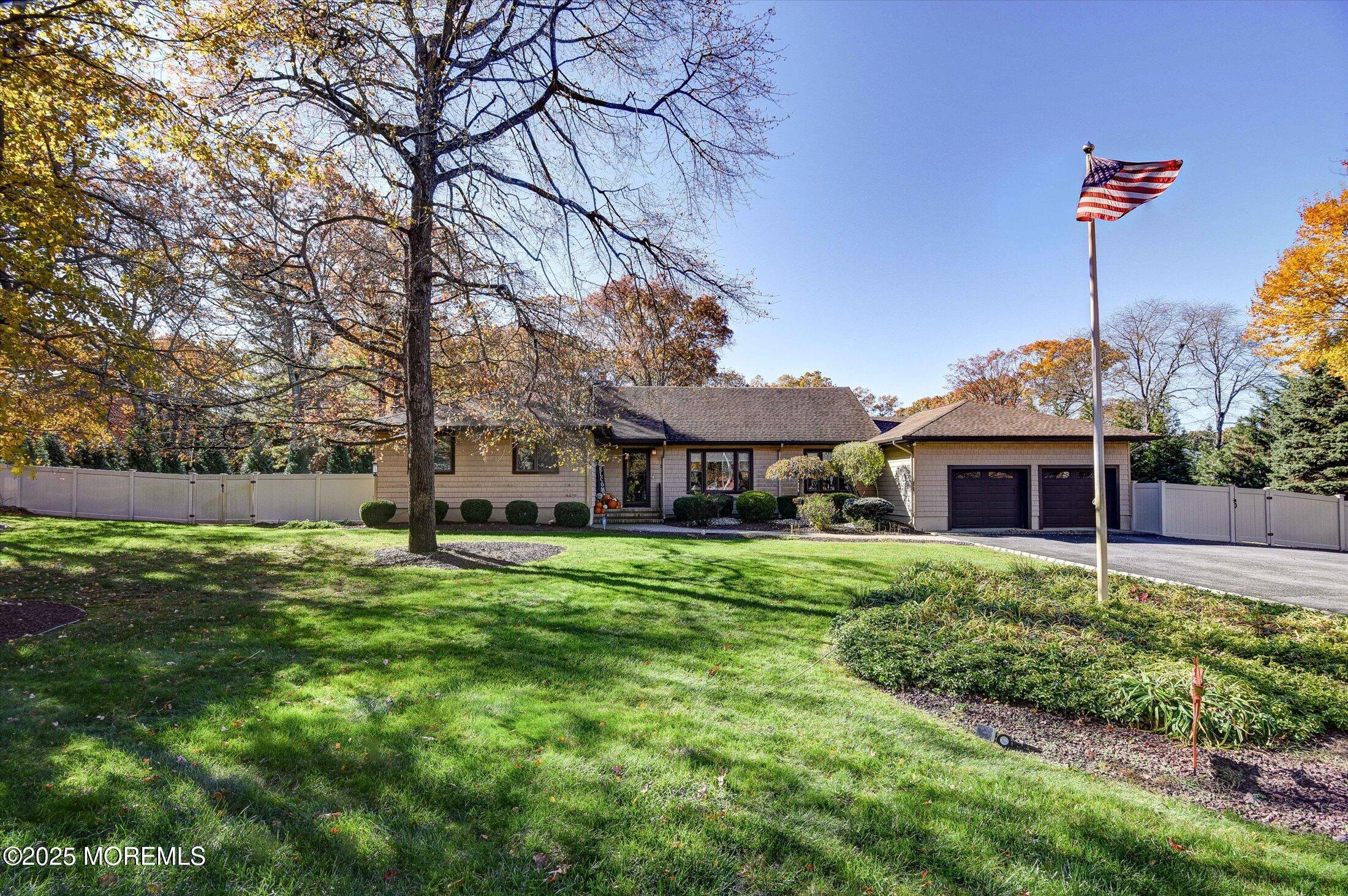 2 Lyndon Lane Howell, NJ 07731 - Photo 2 of 51 a front view of a house with a yard and trees