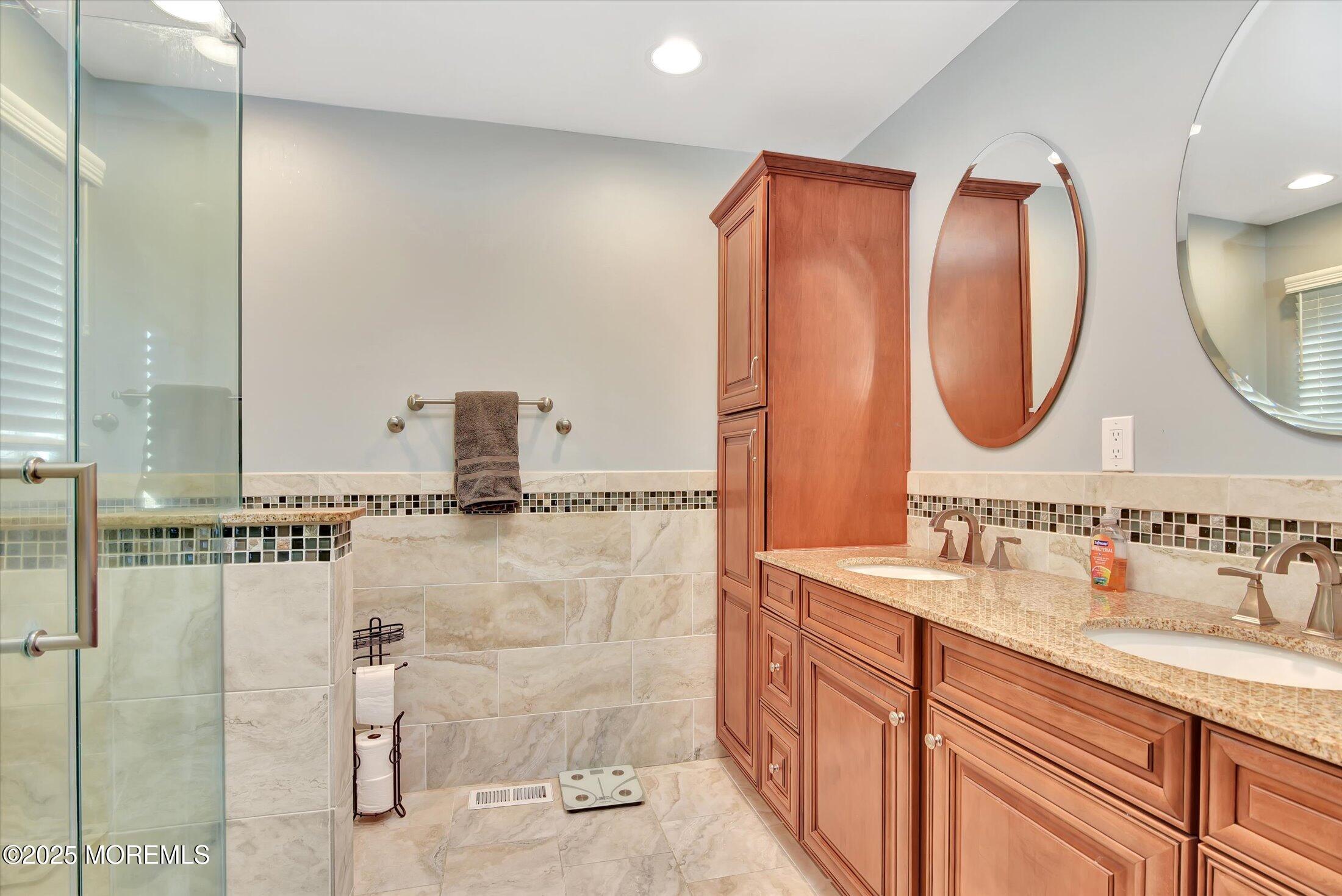 2 Lyndon Lane Howell, NJ 07731 - Photo 23 of 51 a bathroom with a double vanity sink mirror and shower