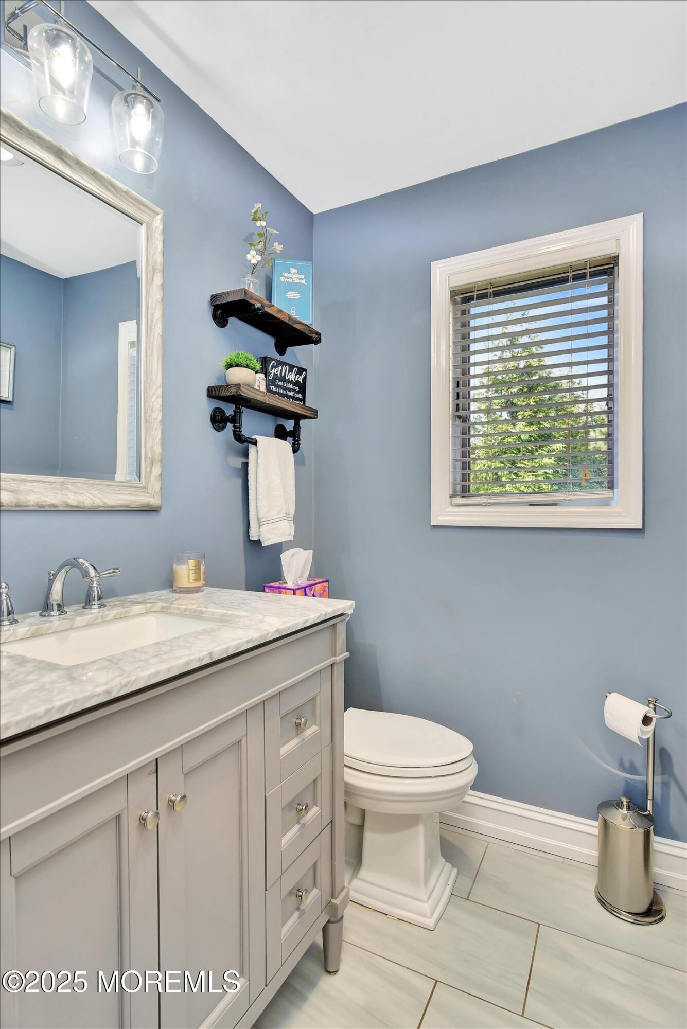2 Lyndon Lane Howell, NJ 07731 - Photo 32 of 51 a bathroom with a granite countertop toilet sink and mirror