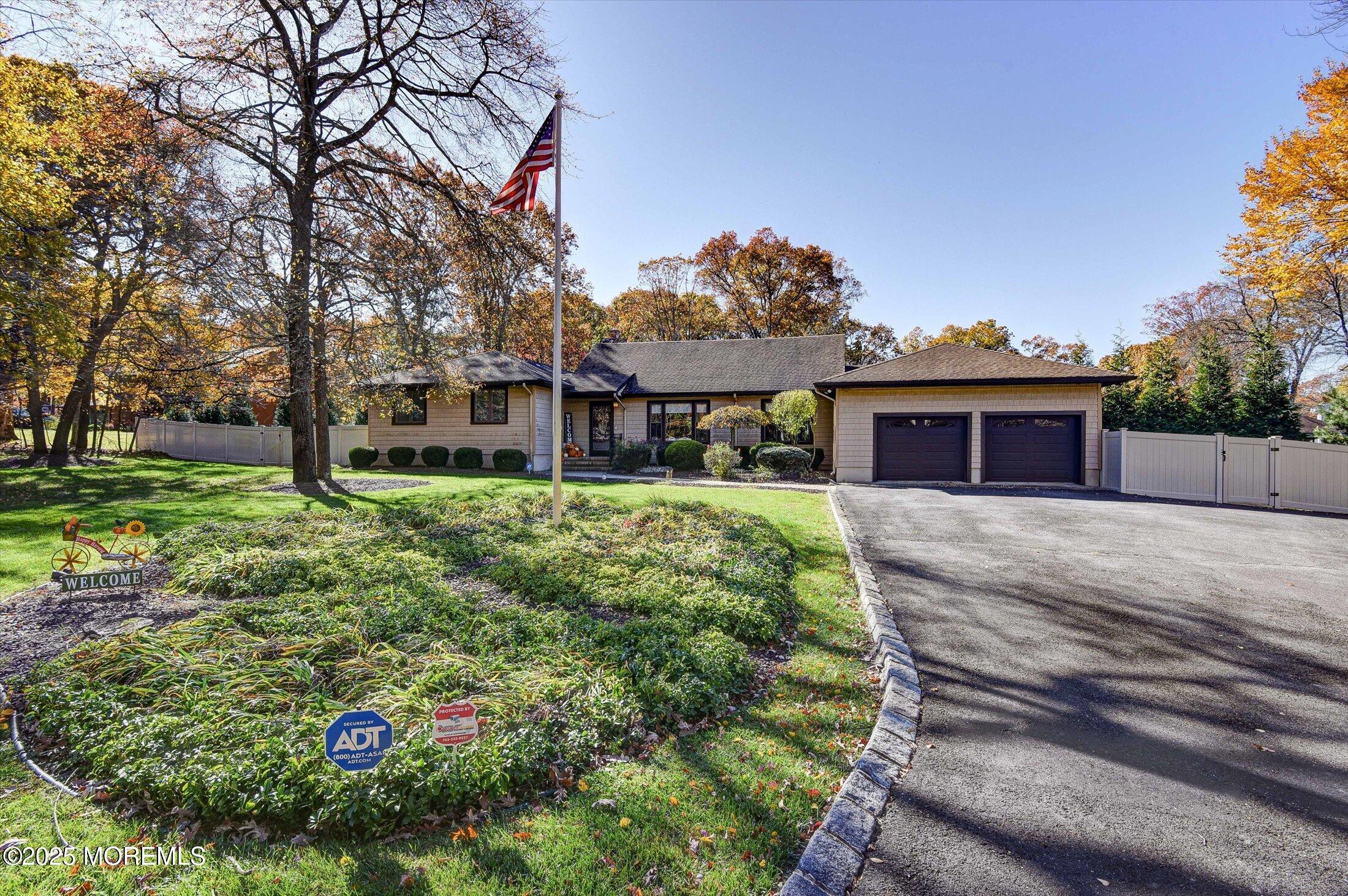 2 Lyndon Lane Howell, NJ 07731 - Photo 4 of 51 a front view of a house with a garden