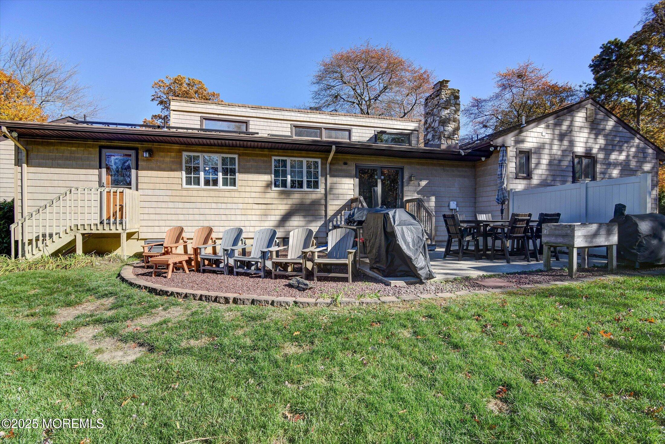2 Lyndon Lane Howell, NJ 07731 - Photo 41 of 51 a view of a chairs and table in backyard of the house