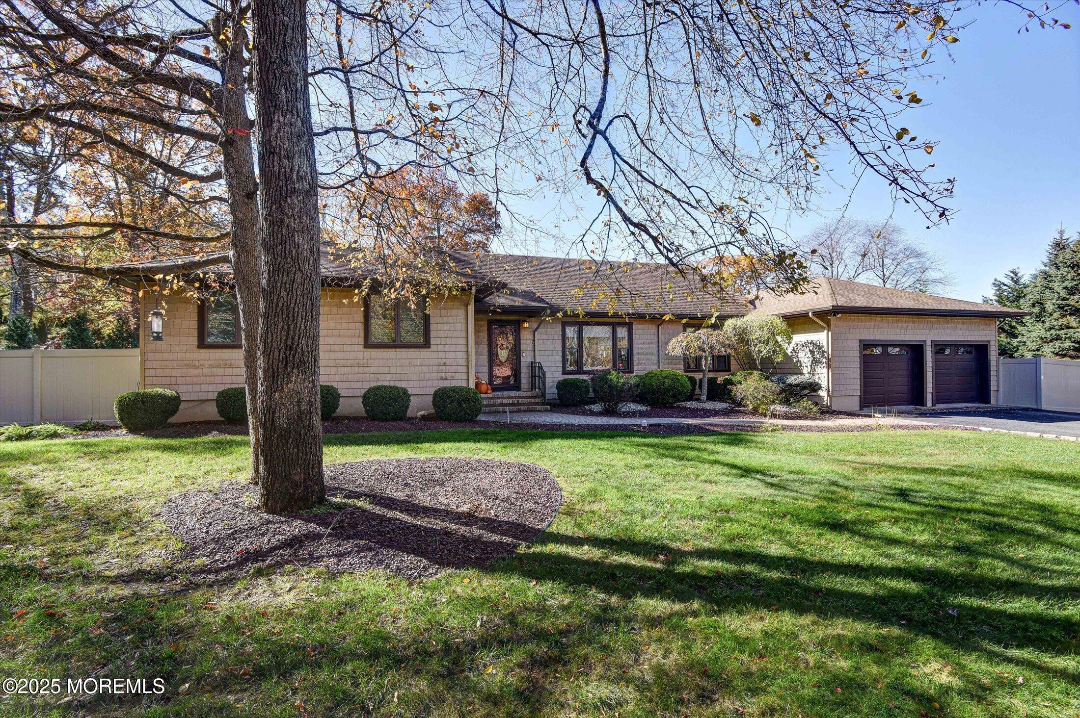 2 Lyndon Lane Howell, NJ 07731 - Photo 6 of 51 a front view of a house with a garden