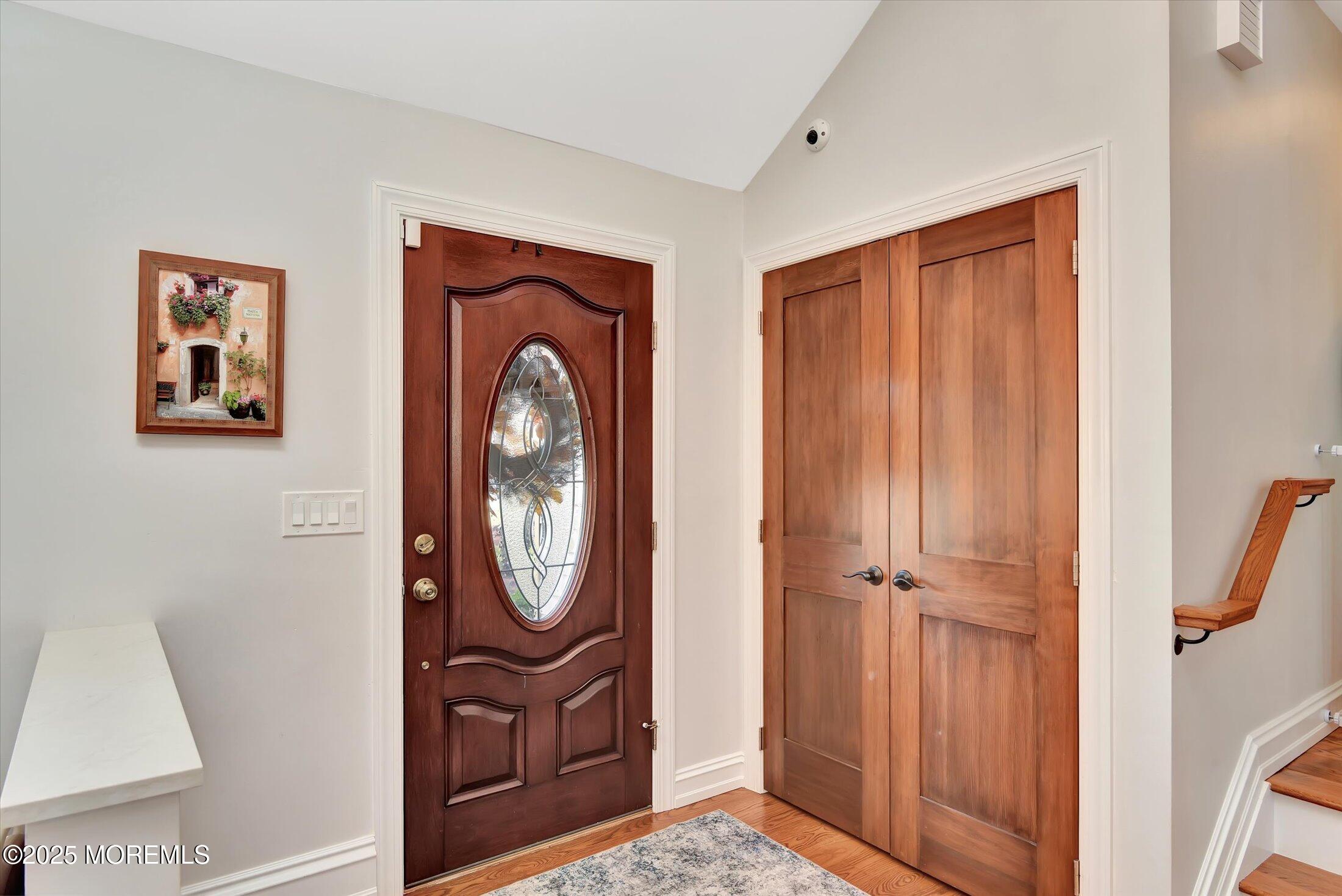 2 Lyndon Lane Howell, NJ 07731 - Photo 7 of 51 a front view of a house with entryway wooden floor door and mirror