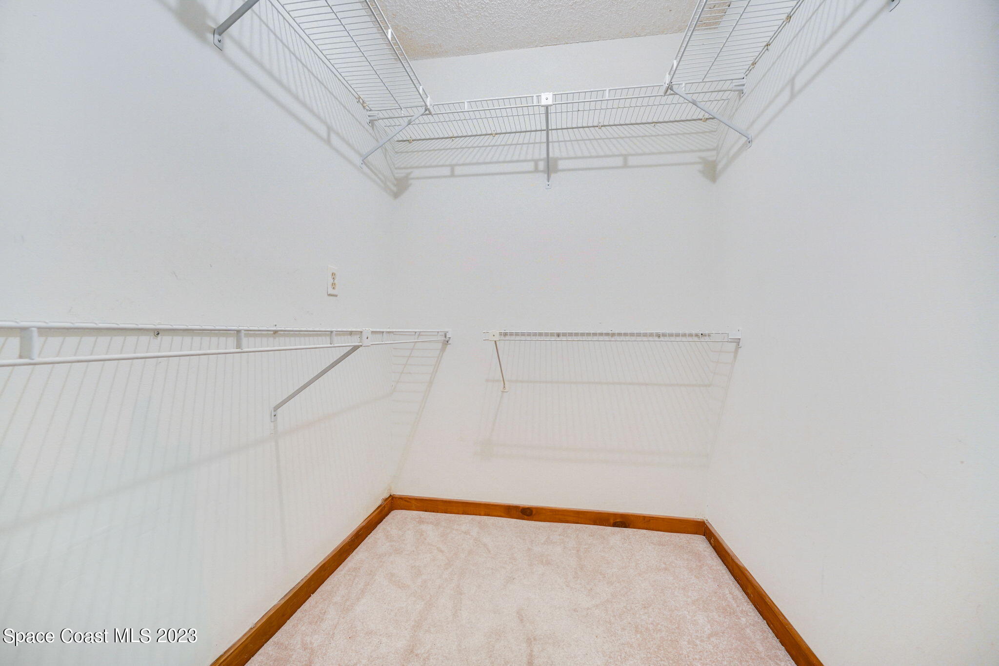1250 Faulkingham Road Merritt Island, FL 32952 - Photo 9 of 10 a view of a room with racks on the wall