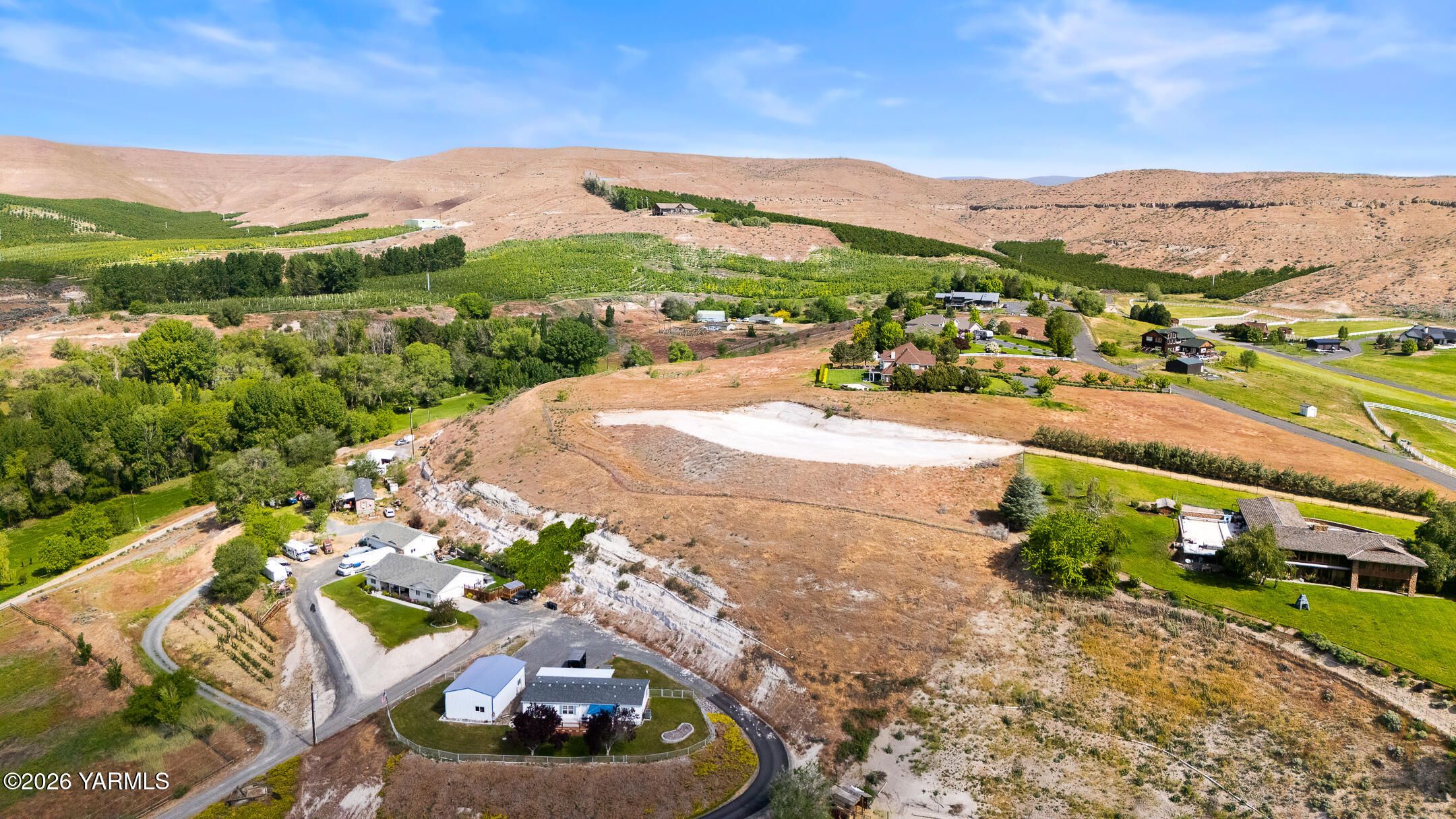 Nka Selah Ridge Drive, Unit 1 Selah, WA 98942 - Photo 1 of 5 a view of a city with a lake