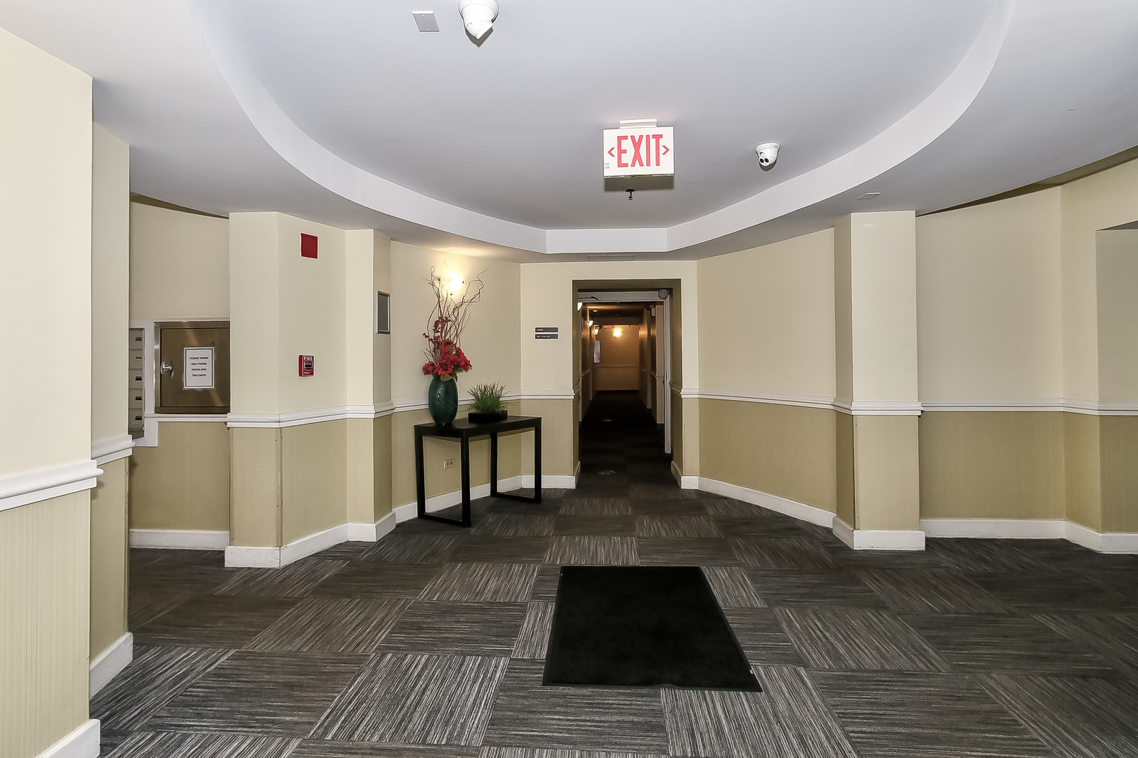 3255 Kirchoff Road, Unit 208 Rolling Meadows, IL 60008 - Photo 20 of 21 a view of a hallway with wooden floor