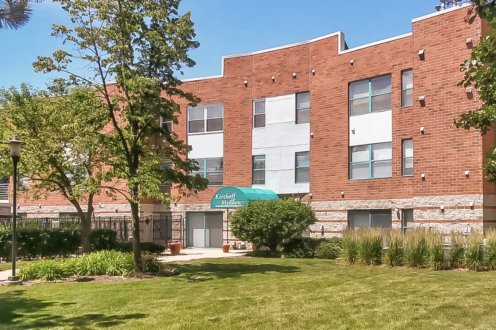 3255 Kirchoff Road, Unit 208 Rolling Meadows, IL 60008 - Photo 2 of 21 a front view of a building with a swimming pool