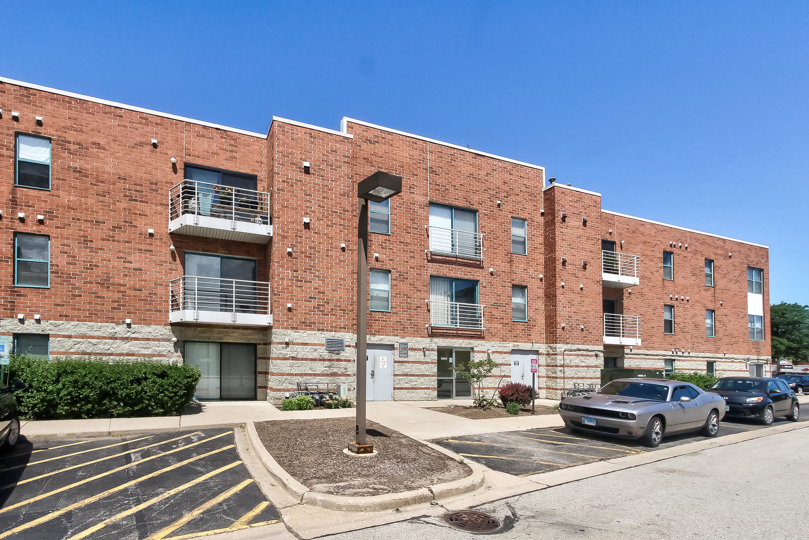 3255 Kirchoff Road, Unit 208 Rolling Meadows, IL 60008 - Photo 4 of 21 a car parked in front of a building