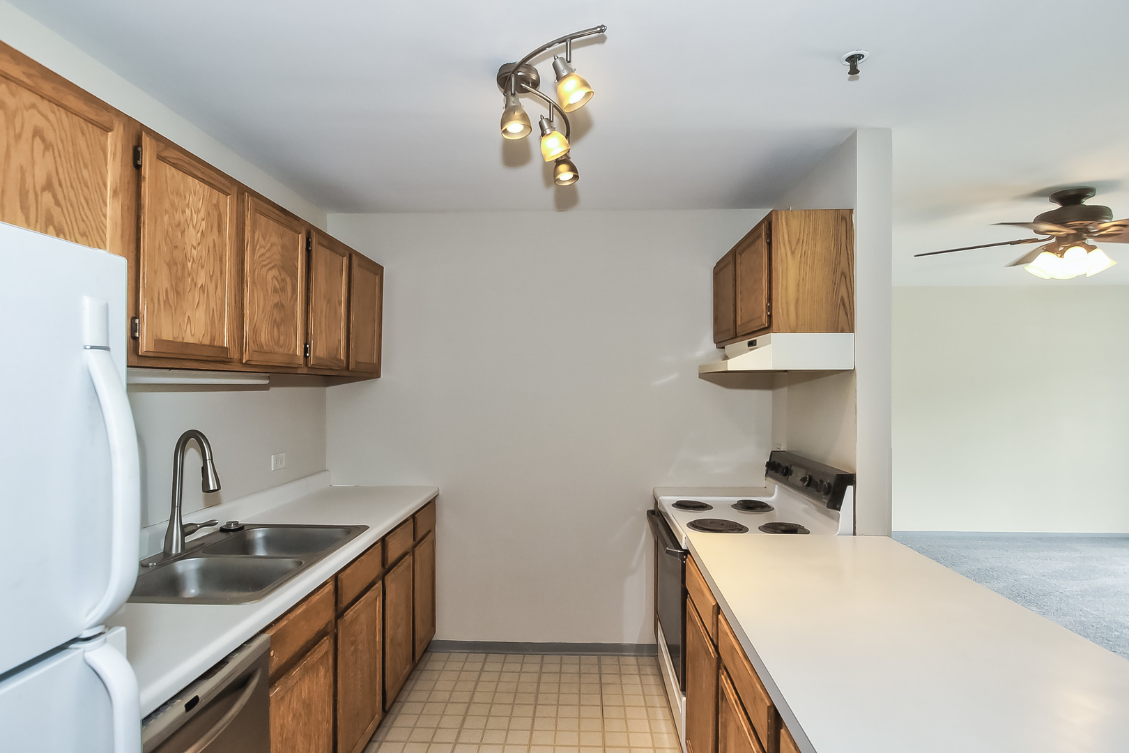 3255 Kirchoff Road, Unit 208 Rolling Meadows, IL 60008 - Photo 9 of 21 a kitchen that has a sink and a stove