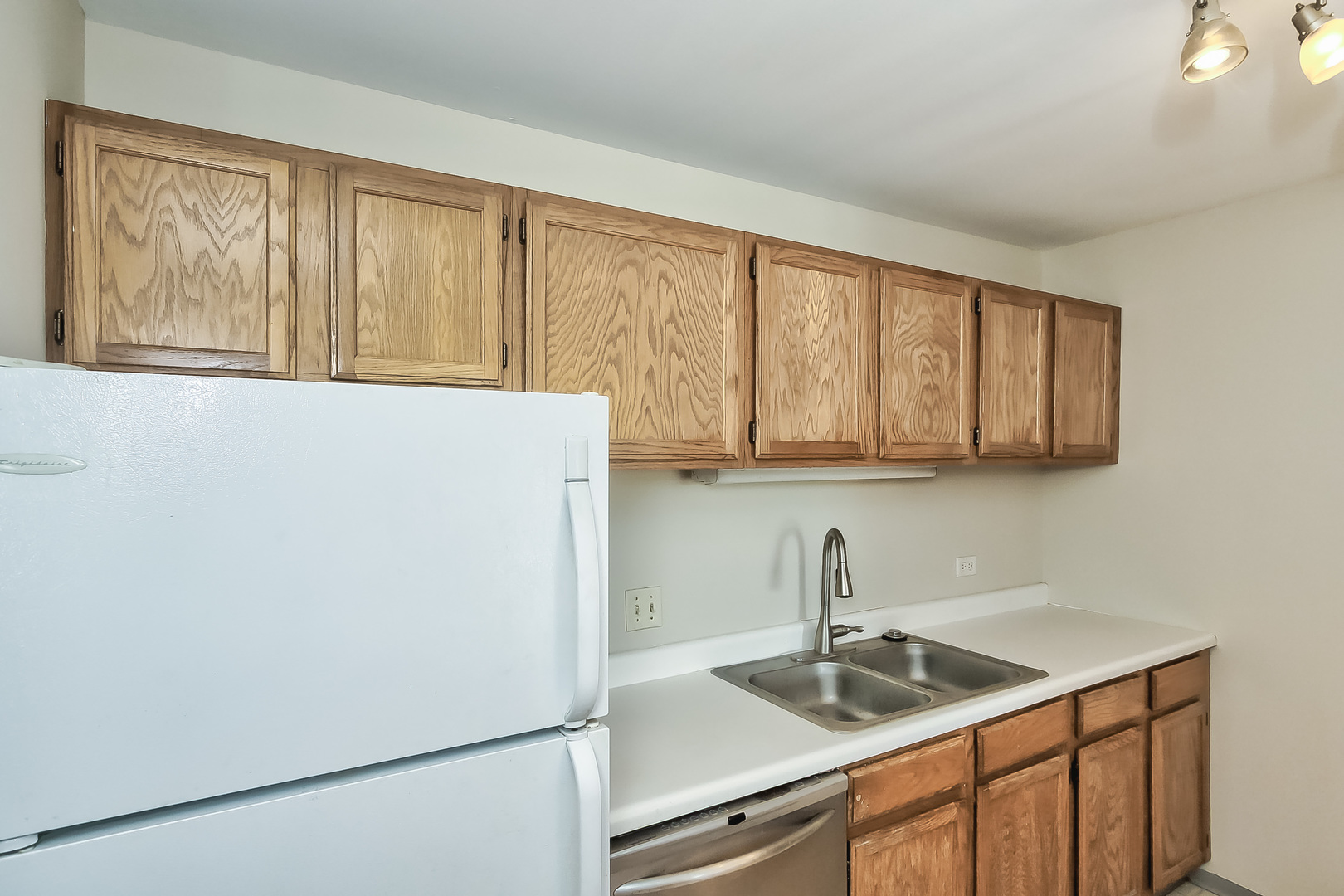 3255 Kirchoff Road, Unit 208 Rolling Meadows, IL 60008 - Photo 10 of 21 a kitchen with a sink and a window