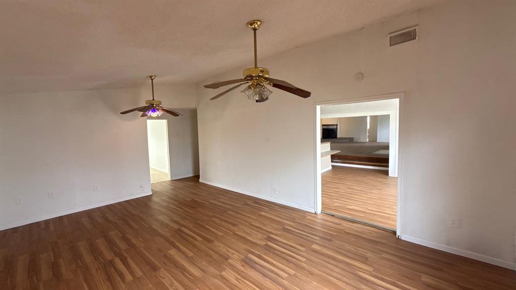 201 East Hubbard Road Josephine, TX 75173 - Photo 12 of 23 a view of a room with wooden floor and ceiling fan