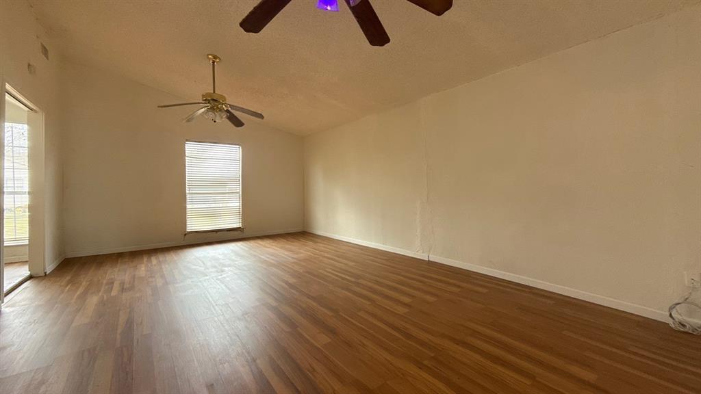 201 East Hubbard Road Josephine, TX 75173 - Photo 13 of 23 an empty room with wooden floor closet and windows