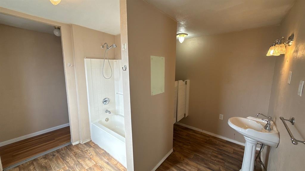 201 East Hubbard Road Josephine, TX 75173 - Photo 15 of 23 a bathroom with a bathtub and shower