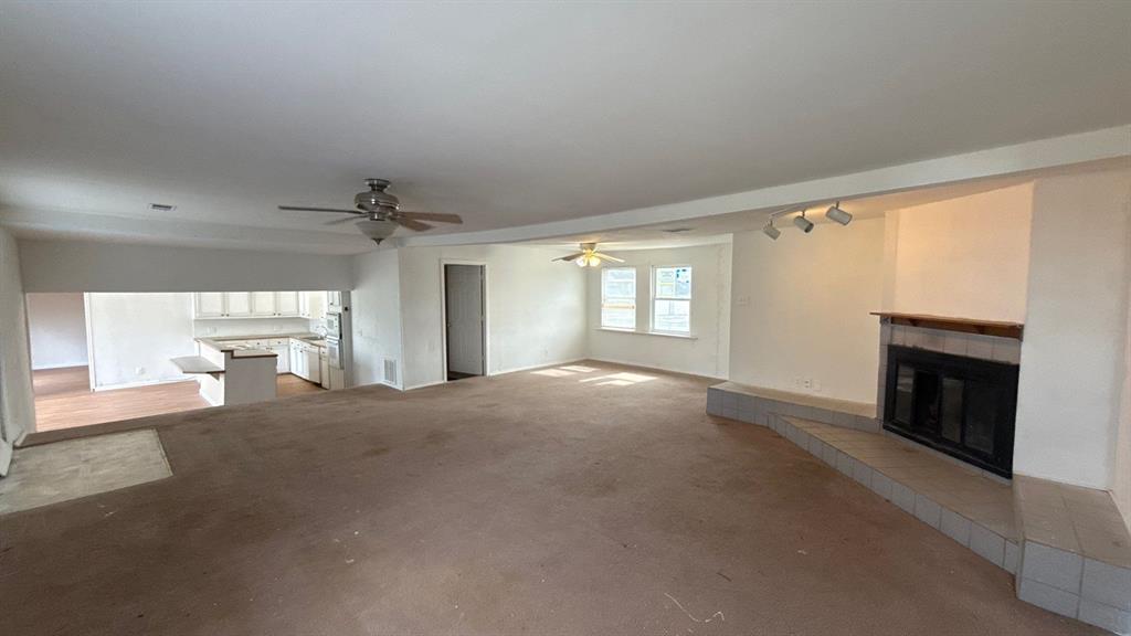 201 East Hubbard Road Josephine, TX 75173 - Photo 5 of 23 a view of empty room with a fireplace and windows