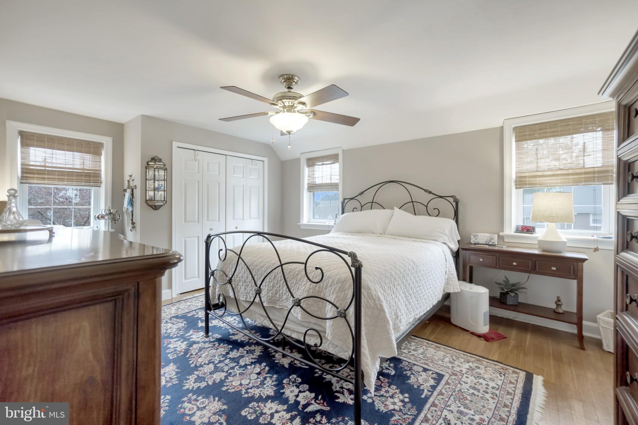 214 Claremont Road Springfield, PA 19064 - Photo 20 of 30 a bedroom with a bed and wooden floor