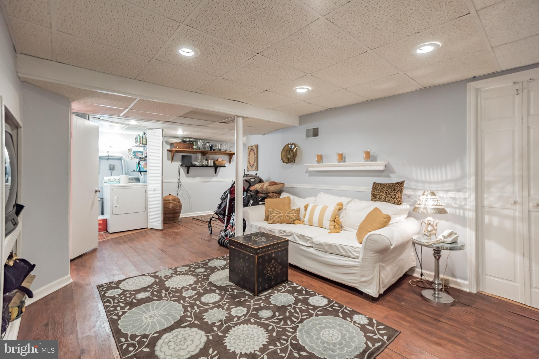 214 Claremont Road Springfield, PA 19064 - Photo 23 of 30 a living room with furniture and a wooden floor