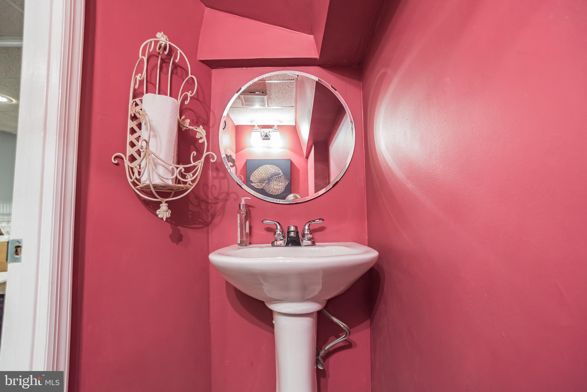 214 Claremont Road Springfield, PA 19064 - Photo 25 of 30 a bathroom with a sink and a mirror