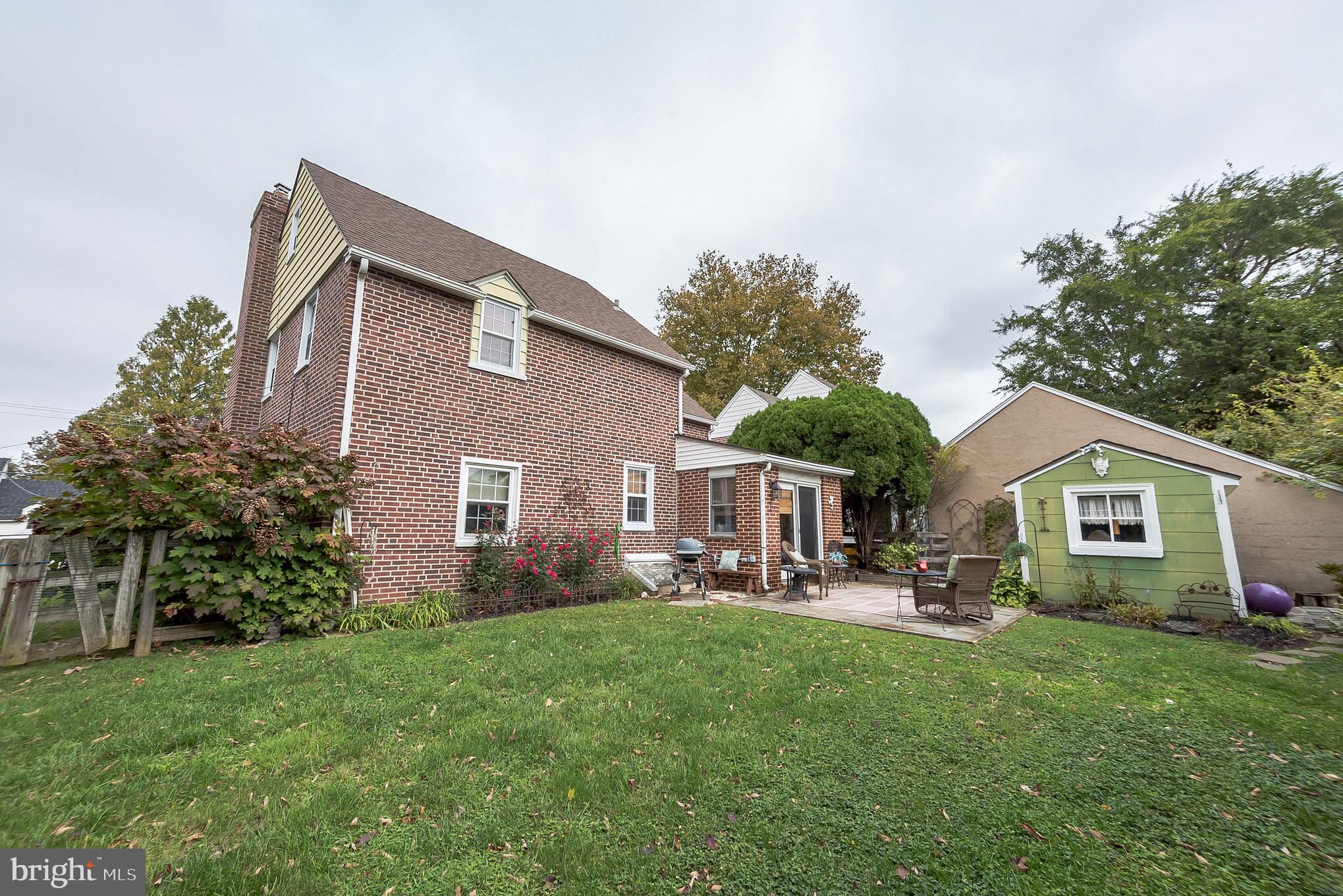 214 Claremont Road Springfield, PA 19064 - Photo 26 of 30 a front view of house with yard and green space