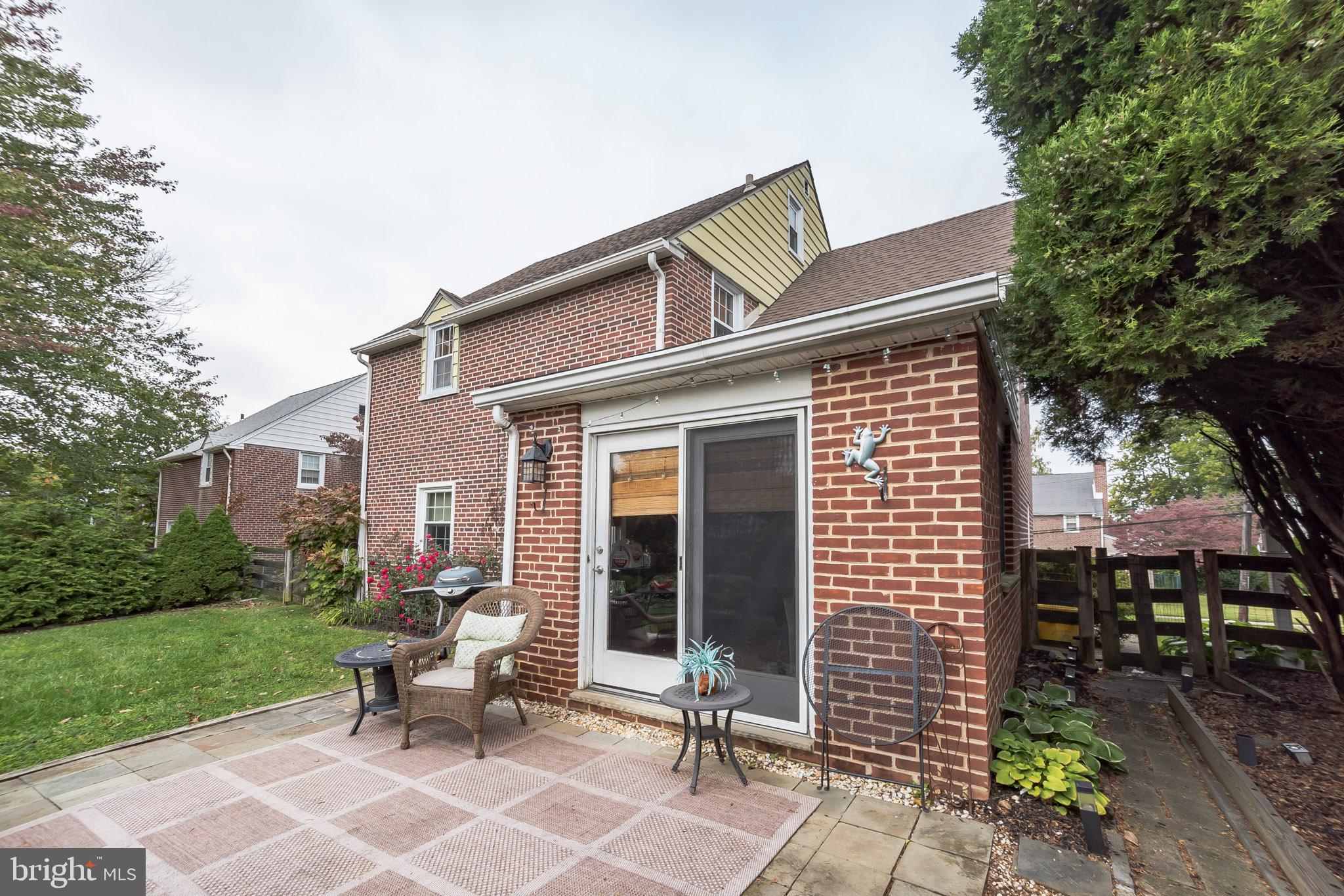 214 Claremont Road Springfield, PA 19064 - Photo 29 of 30 a view of a house with backyard sitting area and garden
