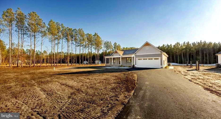 19438 Parsons Road Georgetown, DE 19947 - Photo 1 of 36 Charming home amidst serene pines.