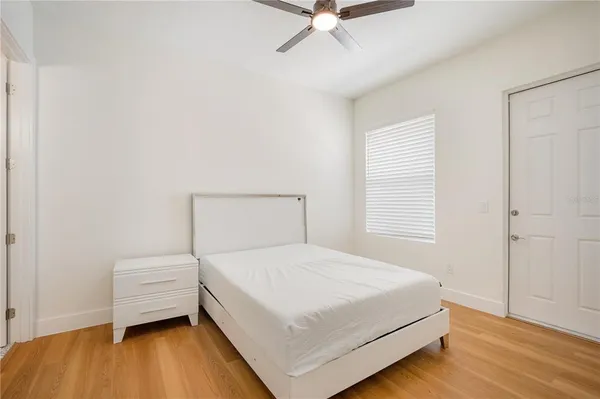 a bedroom with a bed and a dresser