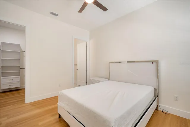 a large white bed in a white room