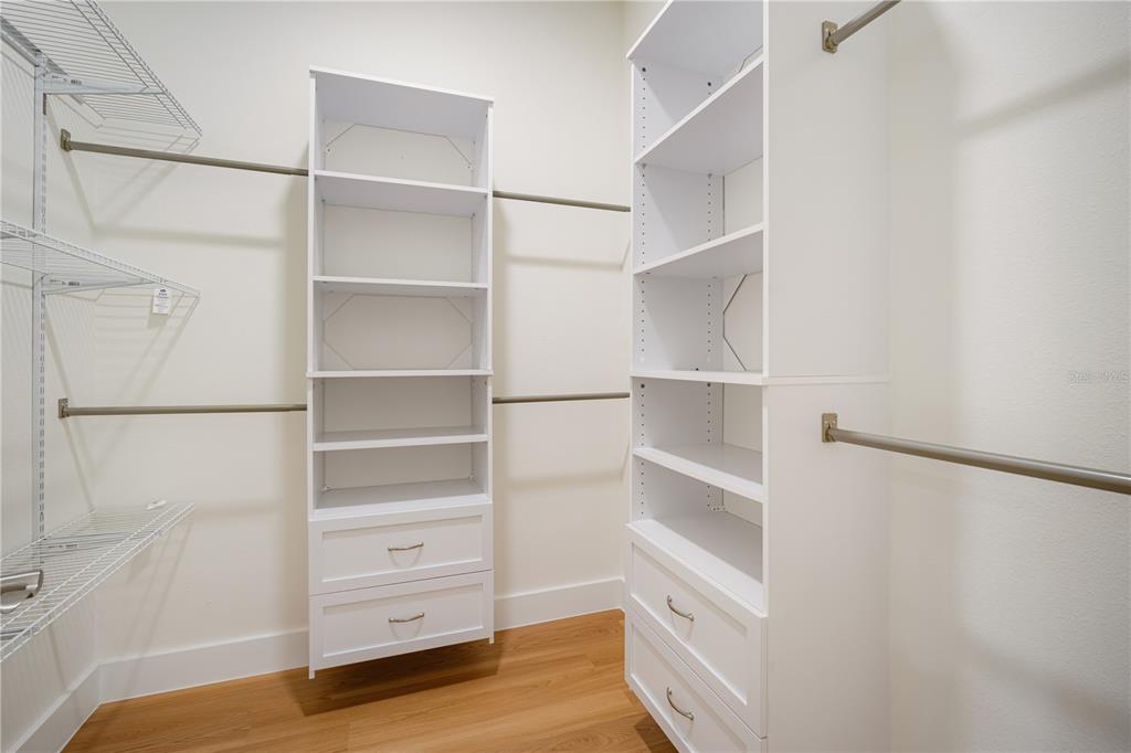 13614 North 22nd Street Tampa, FL 33613 - Photo 21 of 30 a view of walk in closet with empty racks