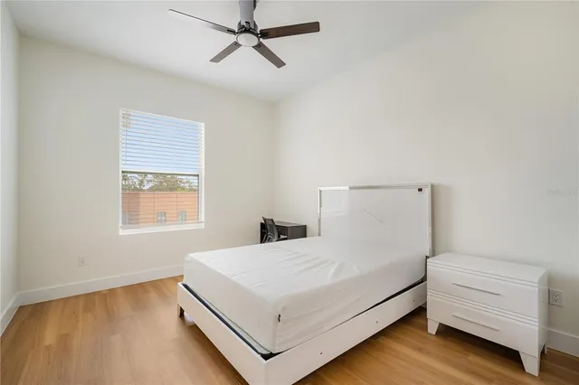 a bedroom with a bed and window