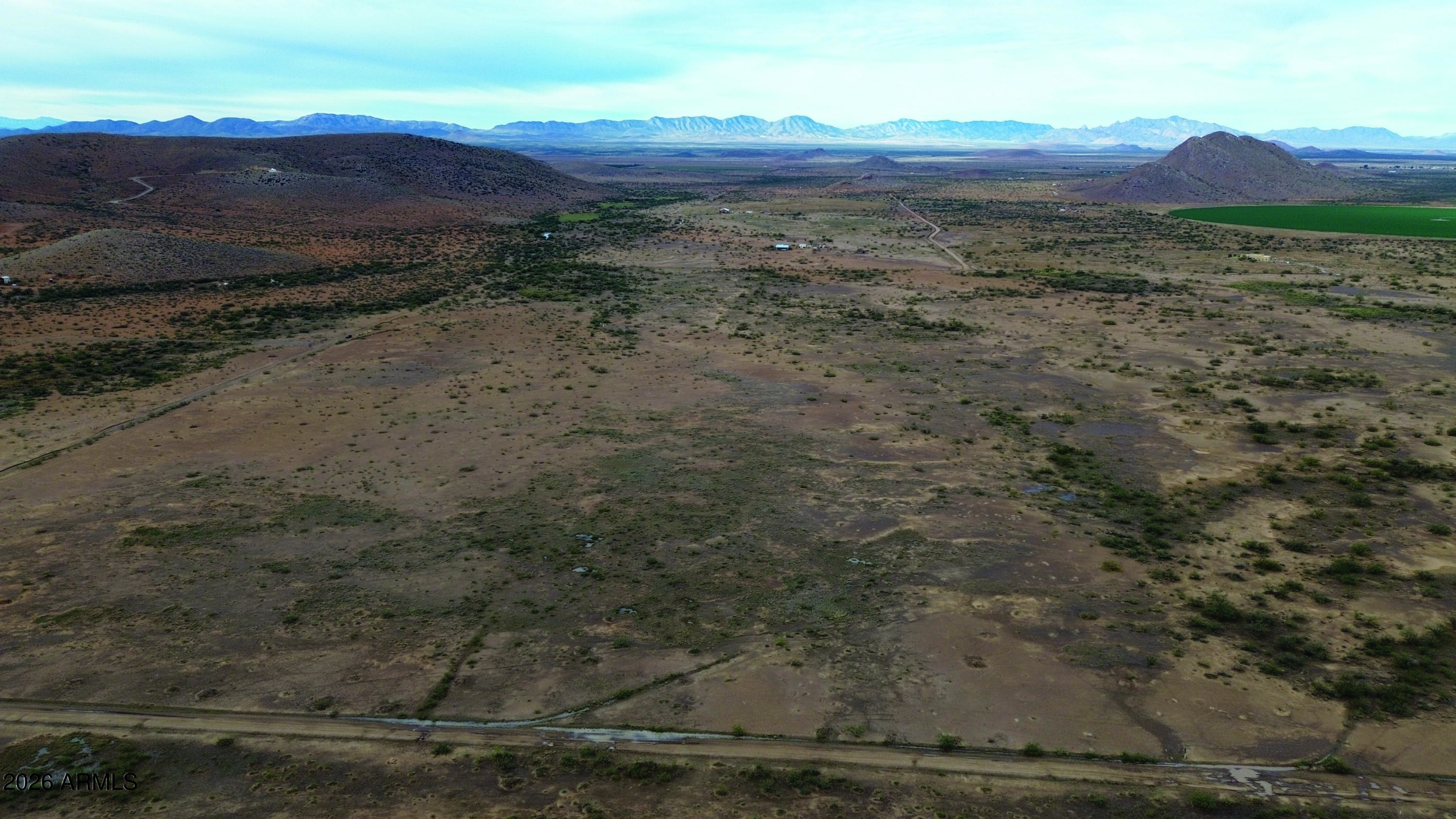 5-acres North Morgan Road, Unit D Pearce, AZ 85625 - Photo 3 of 21 a view of a dry field with lots of trees in it