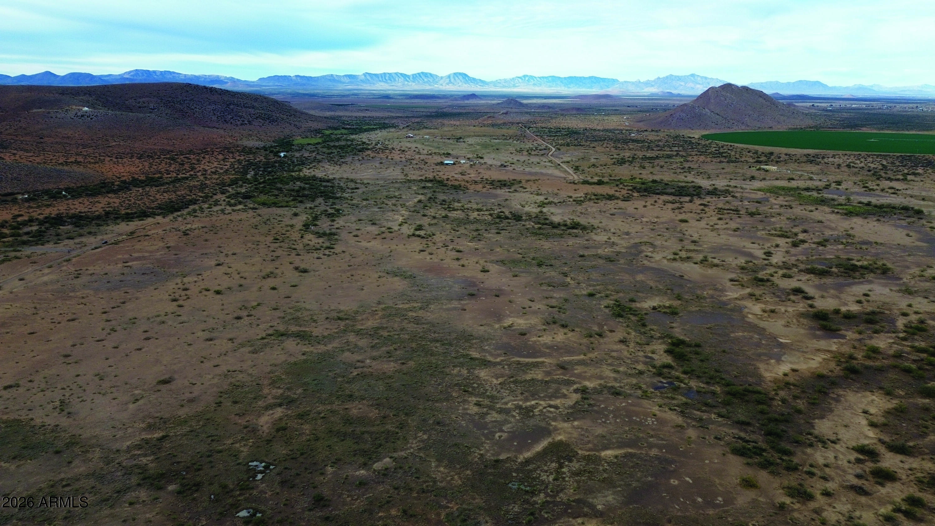 5-acres North Morgan Road, Unit D Pearce, AZ 85625 - Photo 4 of 21 a view of a dry field with mountains in the background