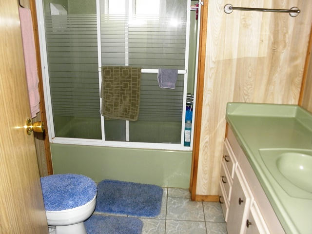 3322 Rim Lakes Drive Overgaard, AZ 85933 - Photo 31 of 36 a bathroom with a toilet and a shower