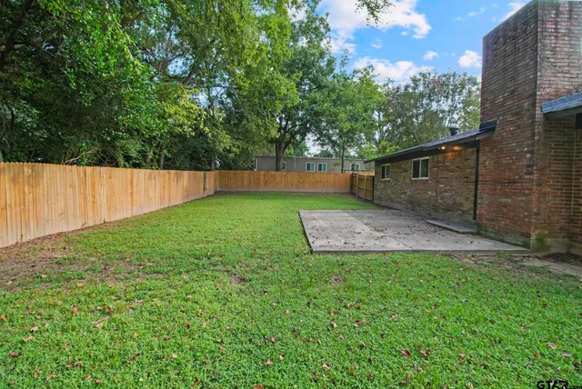 a view of a backyard with a garden