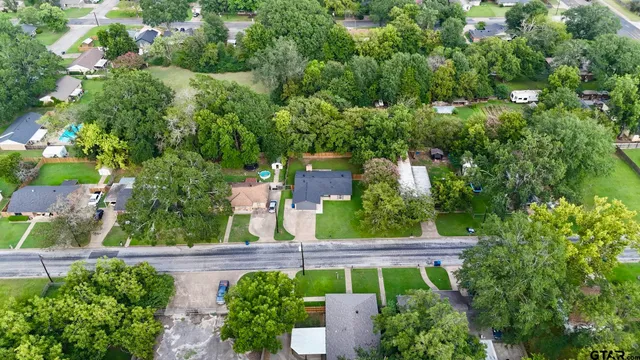 an aerial view of a city with lots of residential buildings