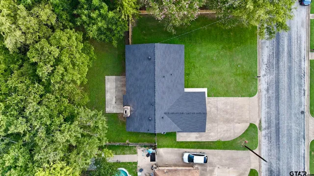 an aerial view of a house with a garden