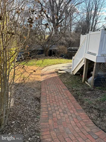 a view of a yard with swimming pool