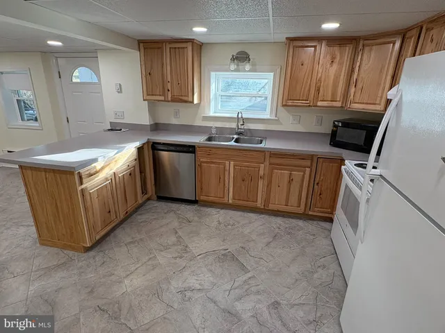a bathroom with a sink toilet and mirror