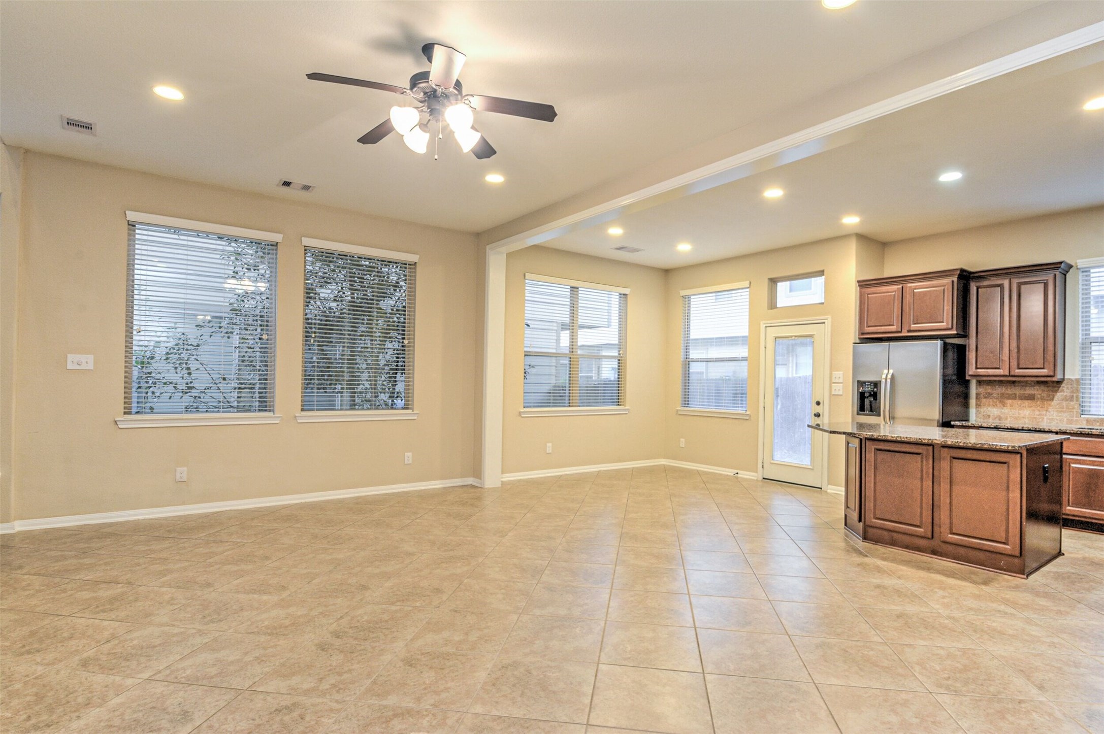 19 Cheswood Manor Court The Woodlands, TX 77382 - Photo 12 of 37 a view of an empty room with window and cabinet