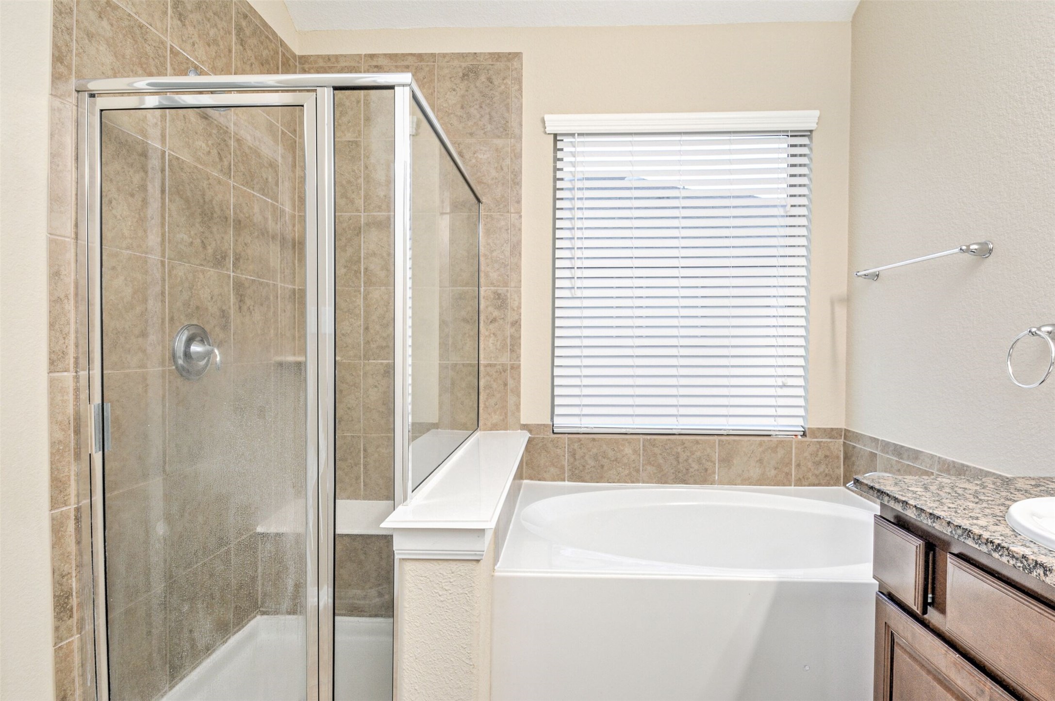 19 Cheswood Manor Court The Woodlands, TX 77382 - Photo 32 of 37 a bathroom with a bathtub and a shower