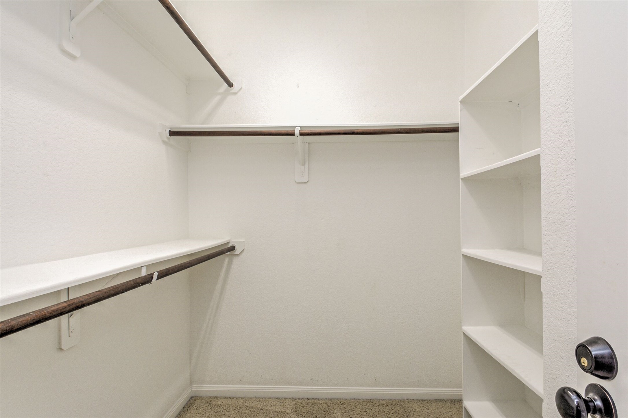 19 Cheswood Manor Court The Woodlands, TX 77382 - Photo 33 of 37 a view of small space with racks on the wall