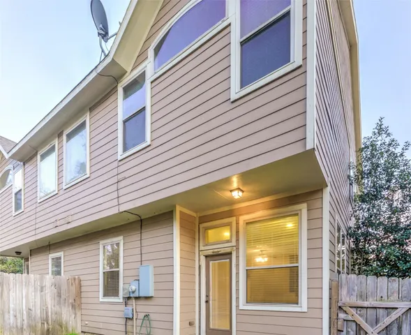 a view of a house with a windows and stairs