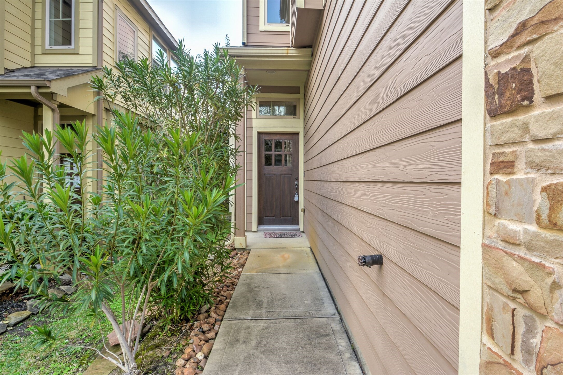 19 Cheswood Manor Court The Woodlands, TX 77382 - Photo 4 of 37 a house with trees in front of it