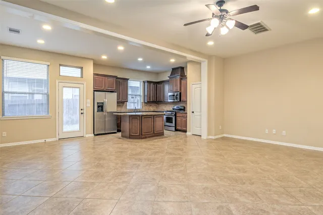 a view of a kitchen with a stove cabinets and a kitchen